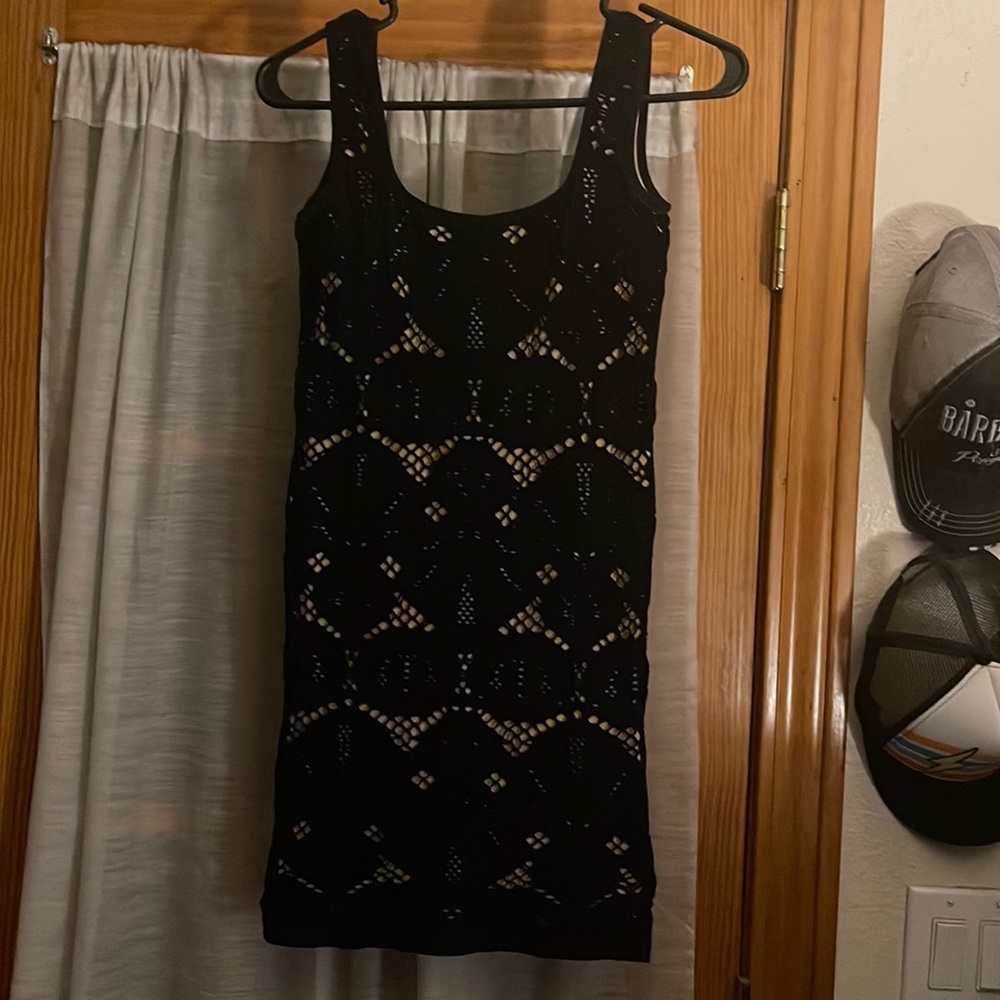 Black dress with nude underlay. Worm once